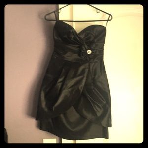 Black dress with flower pin detail